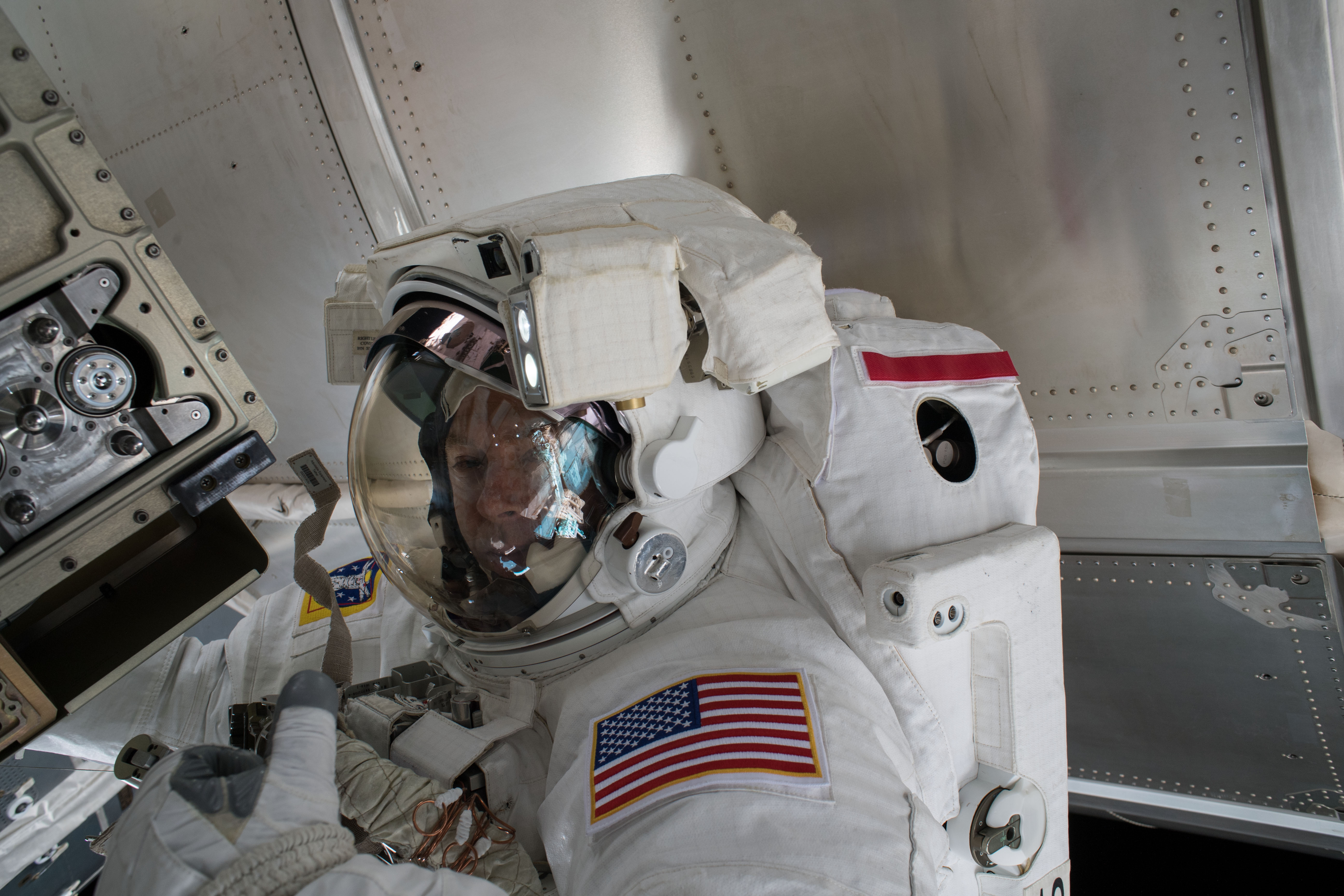 Astronaut Drew Feustel is pictured outside of the International Space Station during a spacewalk on May 16 to swap thermal control gear.