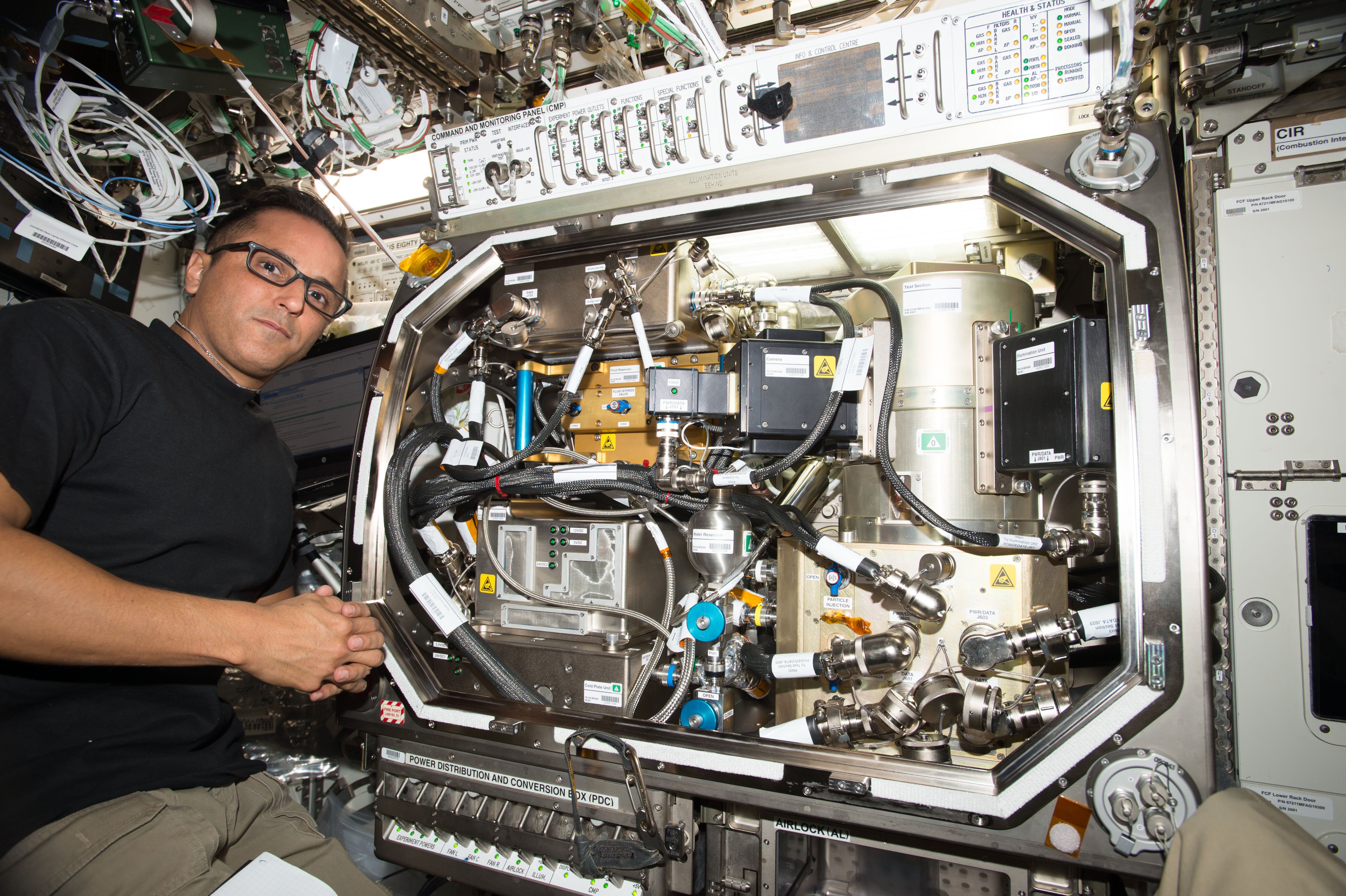 Flight Engineer Joe Acaba works in the U.S. Destiny laboratory module setting up hardware for the Zero Boil-Off Tank (ZBOT) experiment. ZBOT uses a...